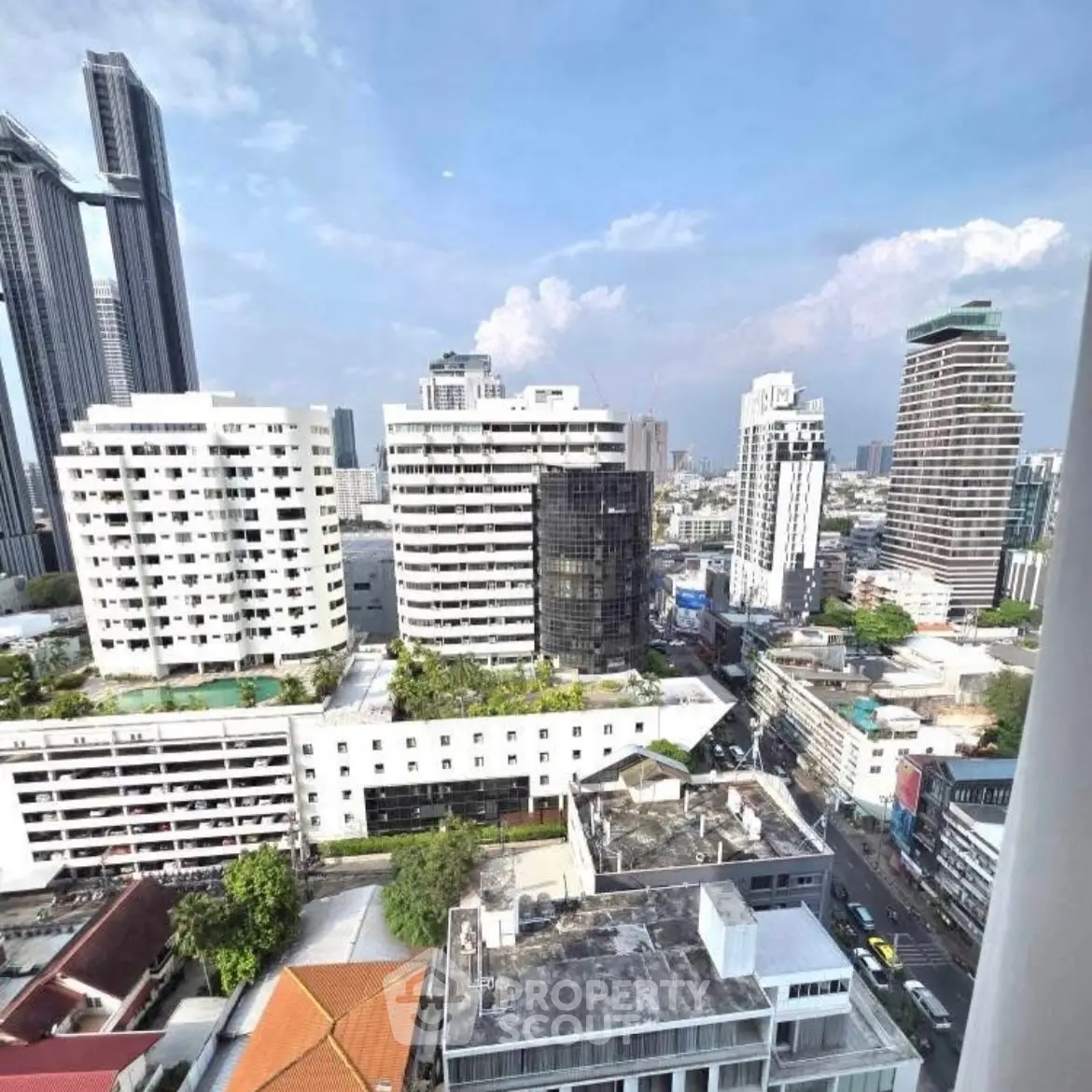Stunning cityscape view from high-rise apartment balcony