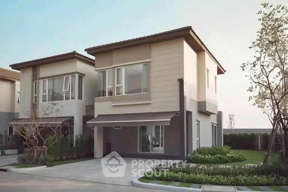 Modern two-story house with landscaped garden and driveway in a serene neighborhood.