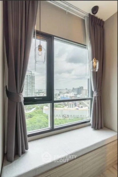 Modern window seat with city view in high-rise apartment