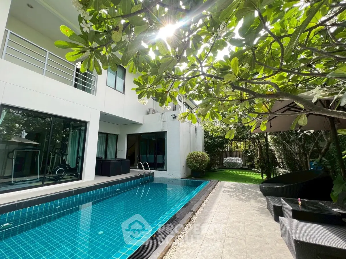 Luxurious modern home with private pool and lush garden, perfect for relaxation and entertaining.