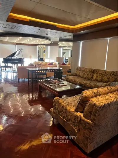 Luxurious living room with grand piano and elegant furnishings, perfect for entertaining.