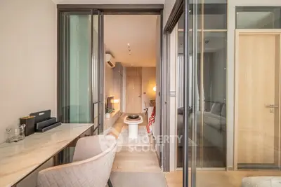 Modern apartment interior with glass partitions and stylish decor