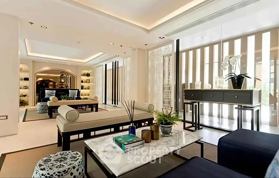 Luxurious modern living room with elegant decor and stylish furniture, perfect for sophisticated living.