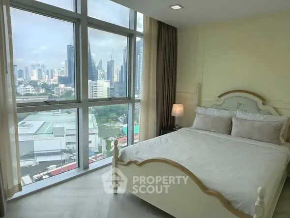 Luxurious bedroom with stunning city view and elegant decor