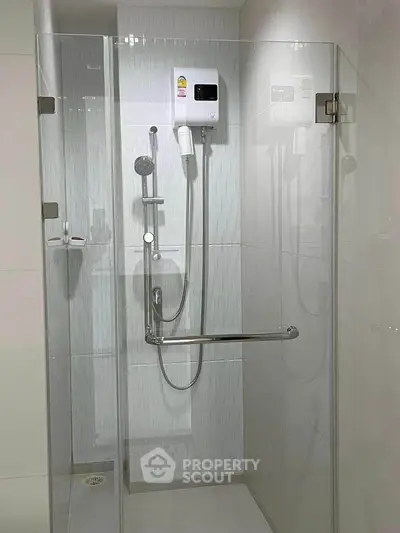 Modern bathroom shower with glass enclosure and sleek fixtures