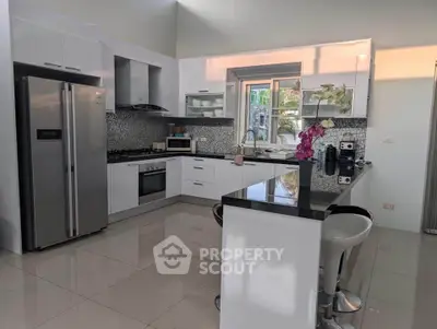 Modern kitchen with sleek appliances and stylish design