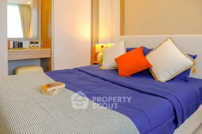 Cozy bedroom with vibrant bedding and stylish decor