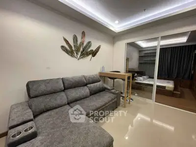 Modern living room with stylish decor and cozy sofa in a contemporary apartment.