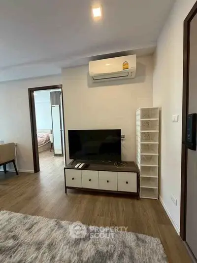 Modern living room with air conditioning and stylish furniture in a cozy apartment.