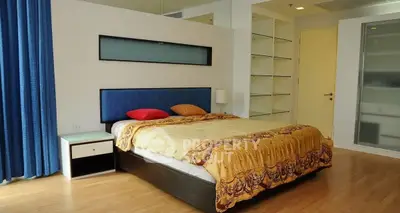 Spacious bedroom with modern design and ample natural light