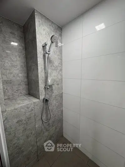 Modern bathroom with sleek shower design and marble tiles