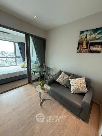 Modern living room with cozy sofa and city view in stylish apartment