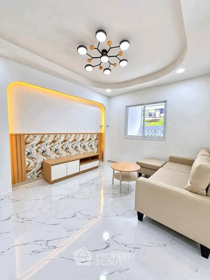 Modern living room with elegant lighting and marble flooring