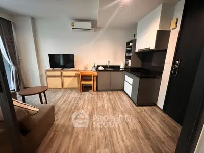 Modern living room with open kitchen and stylish decor