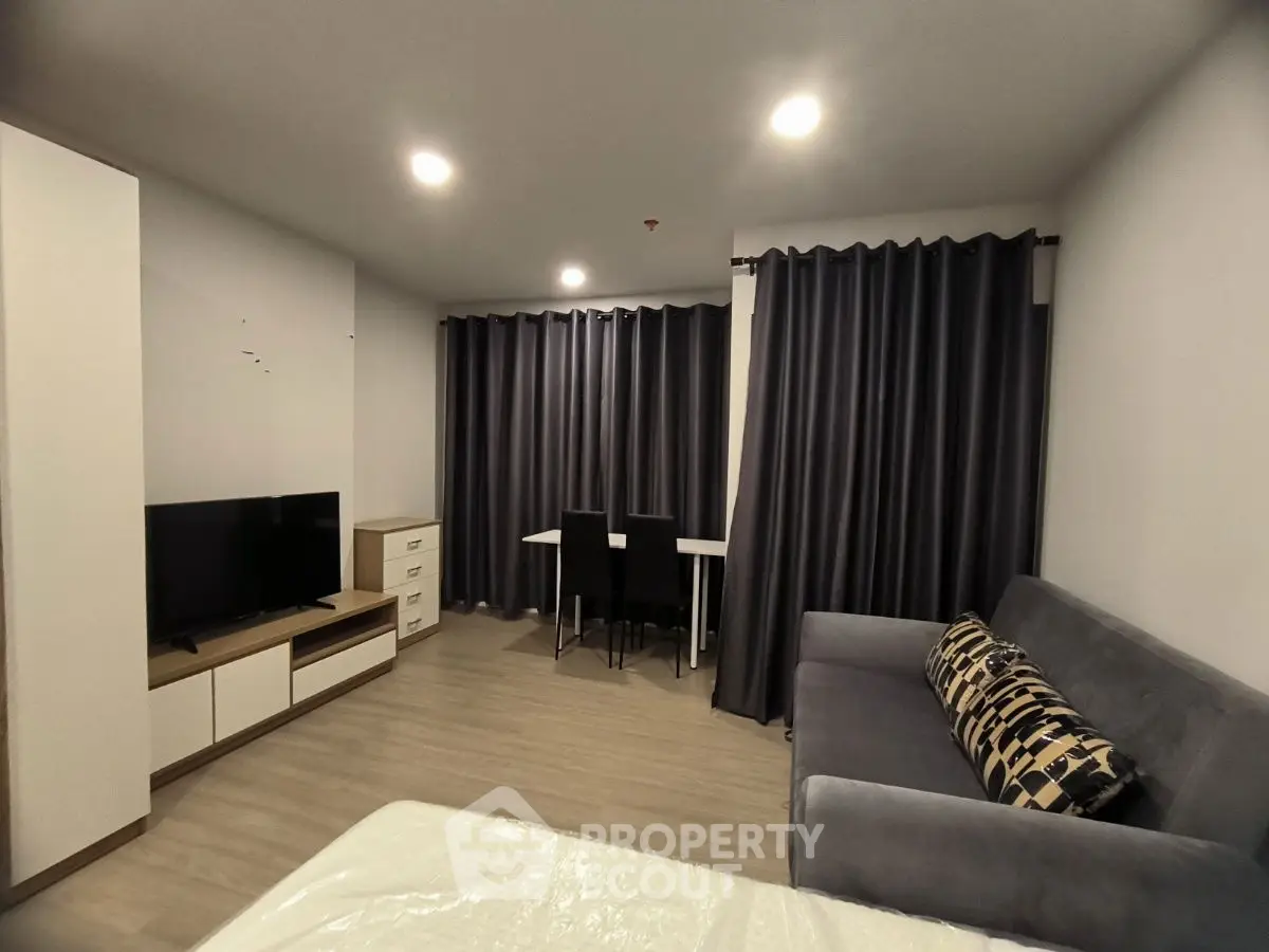 Modern living room with sleek furniture and ambient lighting, perfect for cozy evenings.