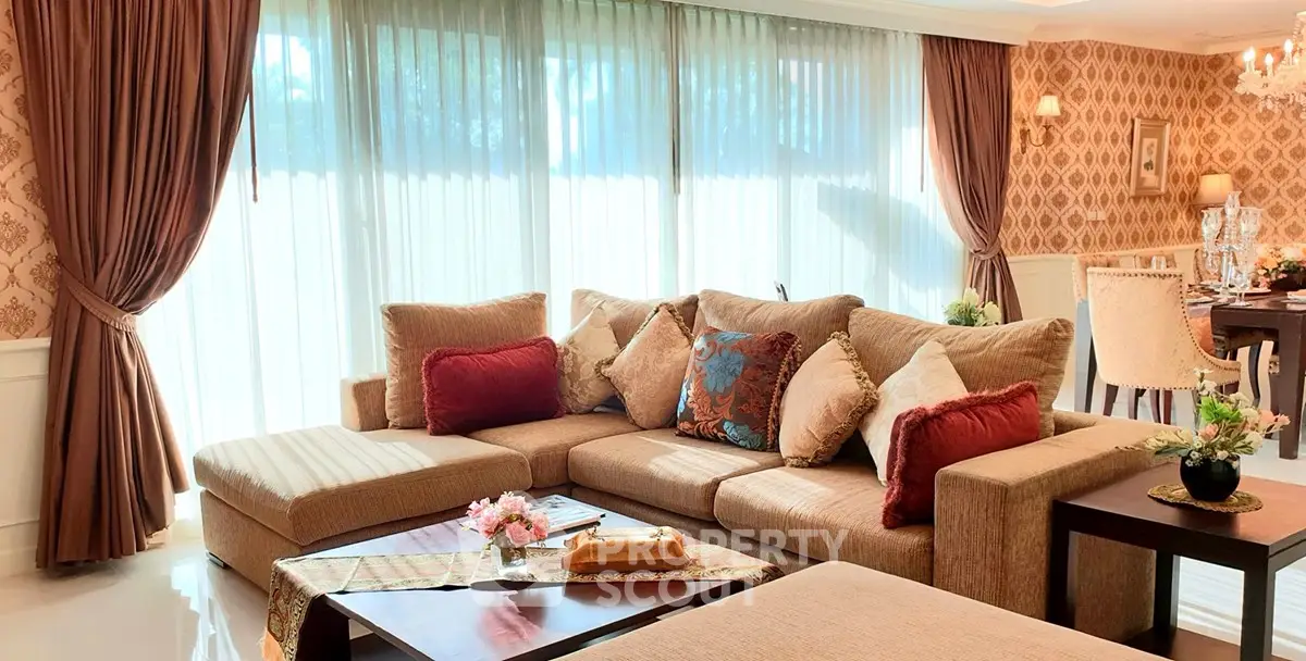 Luxurious living room with elegant decor and large windows in a stylish home.