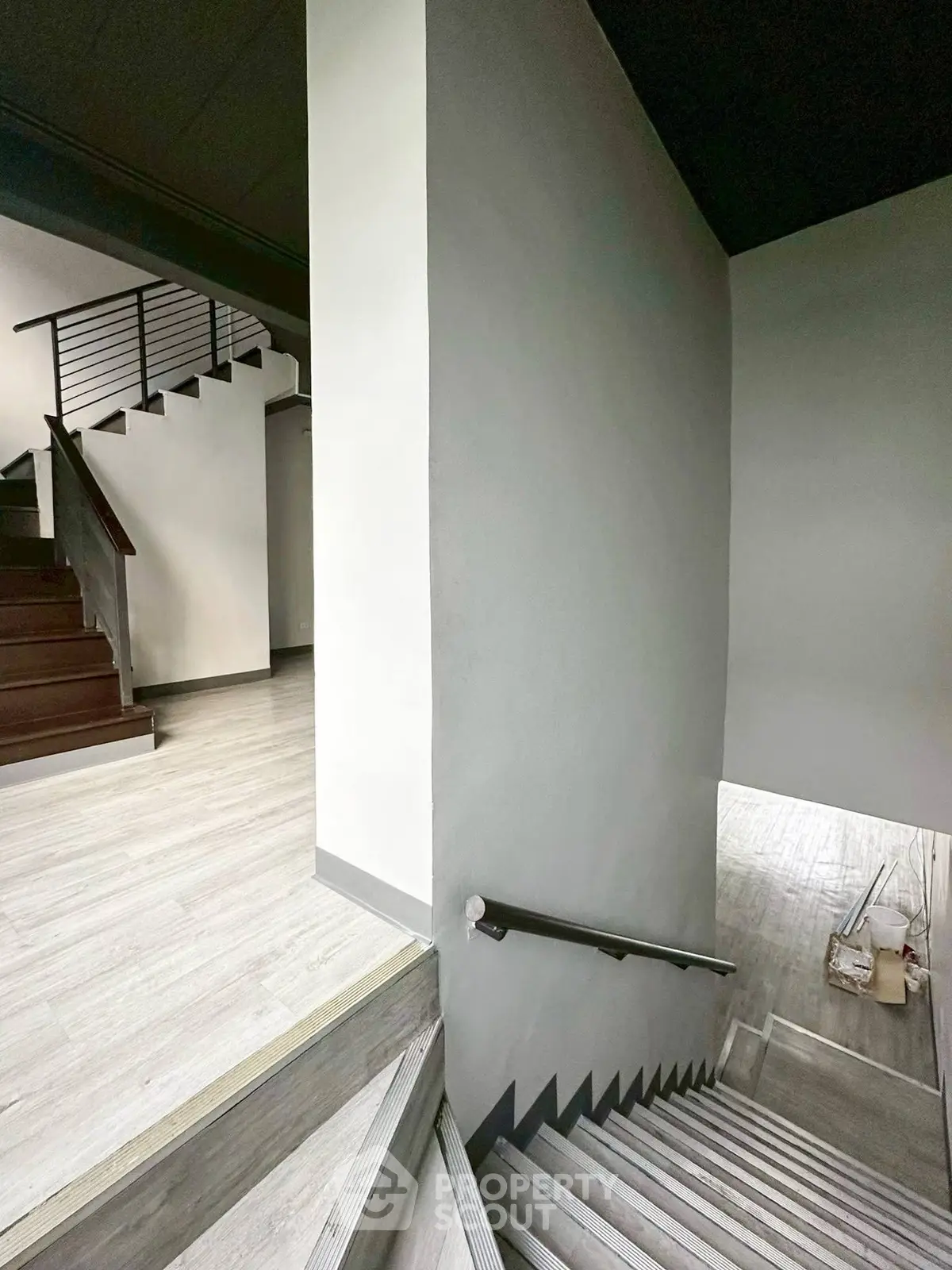 Modern staircase with sleek design and wooden flooring in a contemporary home