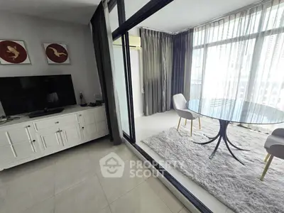 Modern living room with glass table and large windows in a stylish apartment