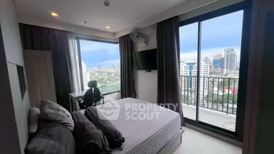 Luxurious bedroom with stunning city view and balcony access