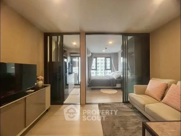 Modern living room with adjacent bedroom in stylish apartment