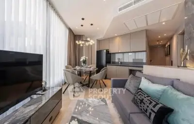 Modern open-plan living room with elegant dining area and sleek kitchen.