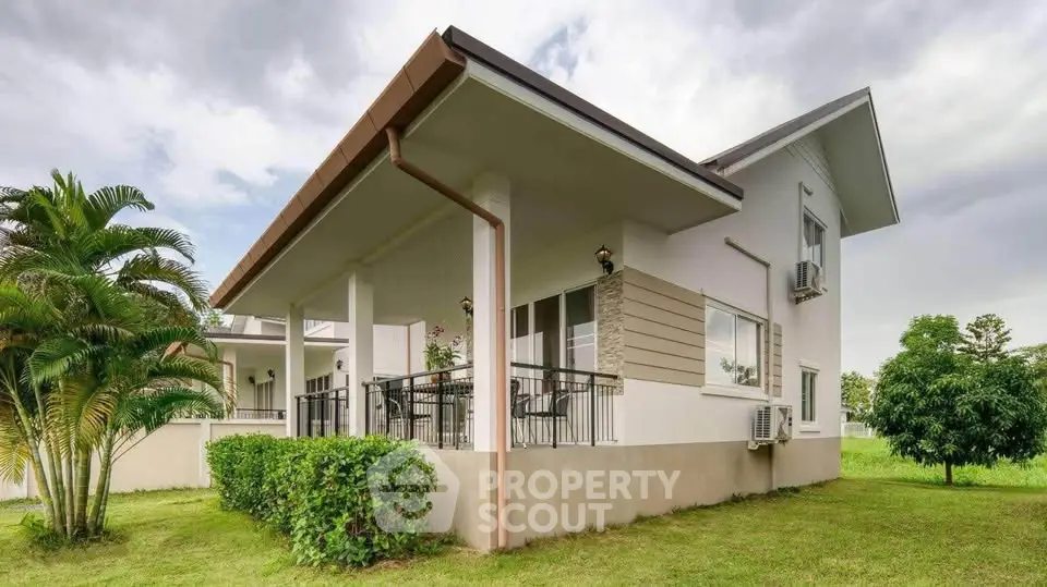 Charming modern house with lush garden and spacious balcony, perfect for serene living.