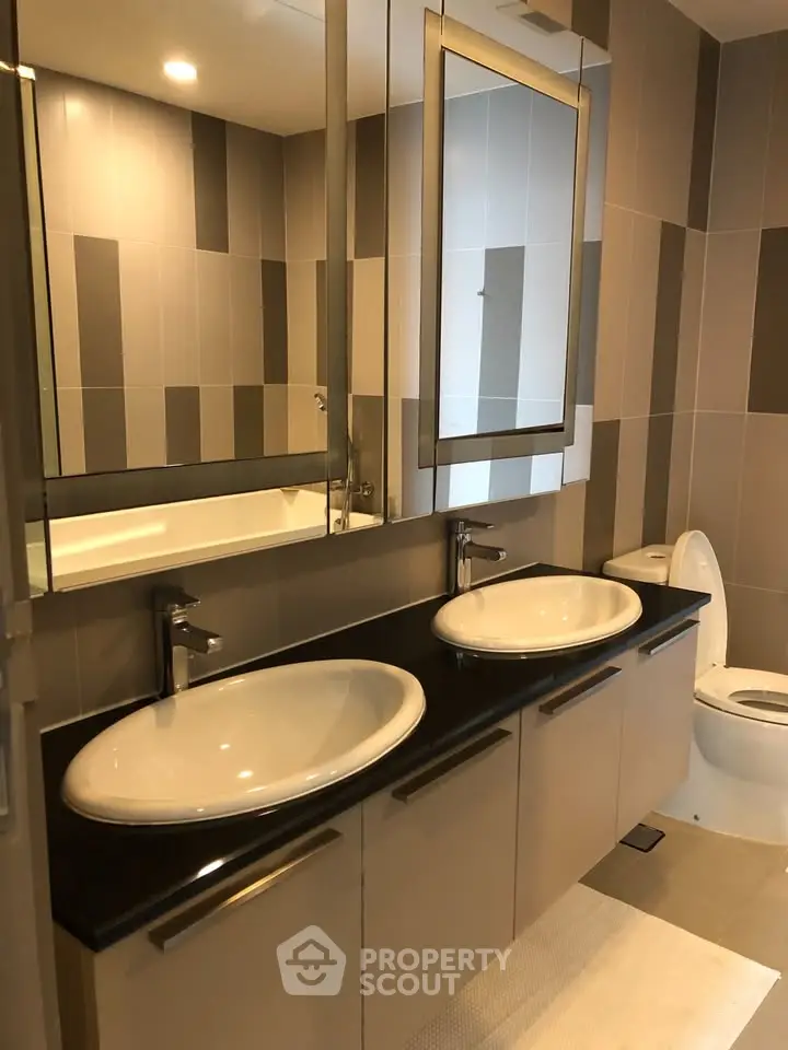 Modern bathroom with dual sinks and stylish tile design