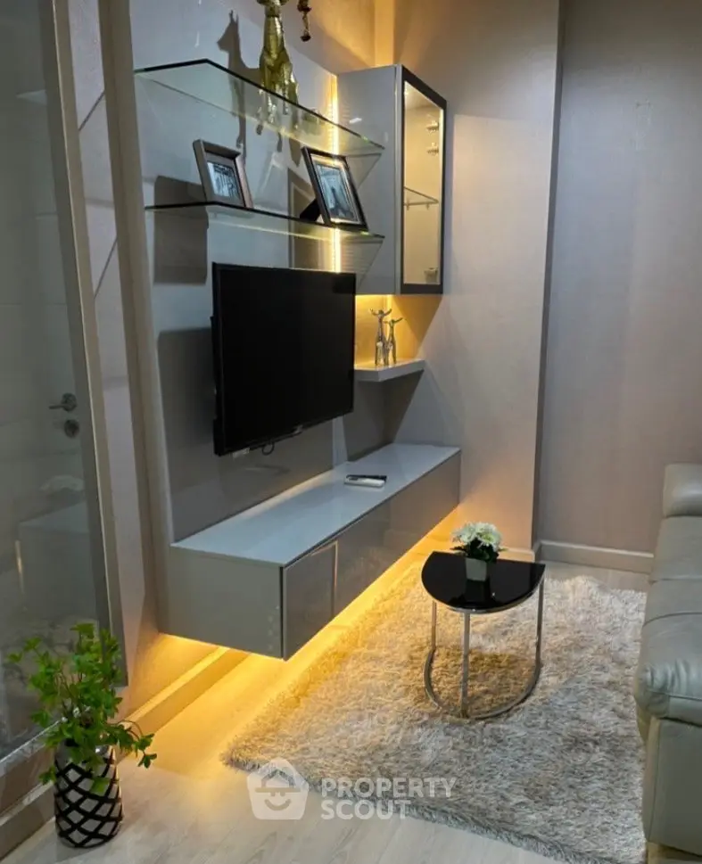 Modern living room with sleek TV unit and cozy decor