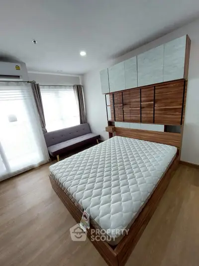 Modern bedroom with stylish wooden furniture and natural light
