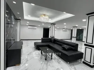Luxurious modern living room with elegant black leather sofa and marble flooring