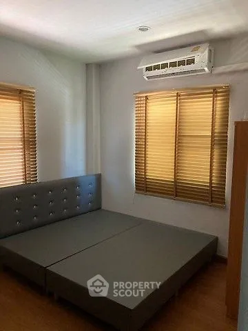 Cozy bedroom with modern air conditioning and stylish blinds