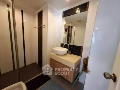 Modern bathroom with stylish sink and elegant tile accents