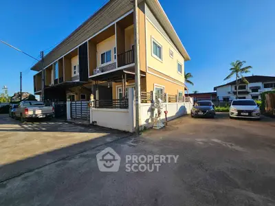 Spacious corner unit townhouse with ample parking and modern design in a serene neighborhood.