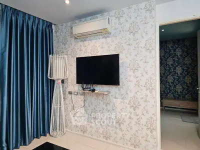 Stylish living room with modern TV setup and elegant wallpaper
