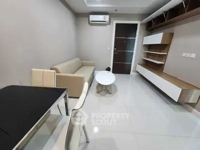 Modern living room with sleek furniture and wall-mounted shelves