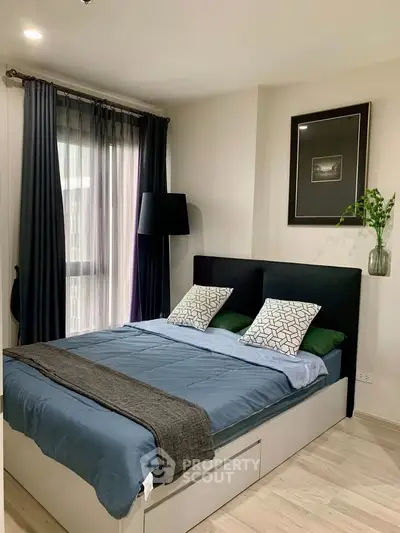 Modern bedroom with stylish decor and natural light