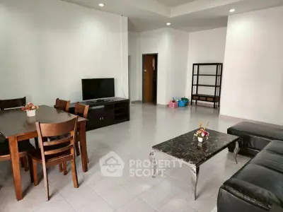 Spacious living room with modern furniture and open layout