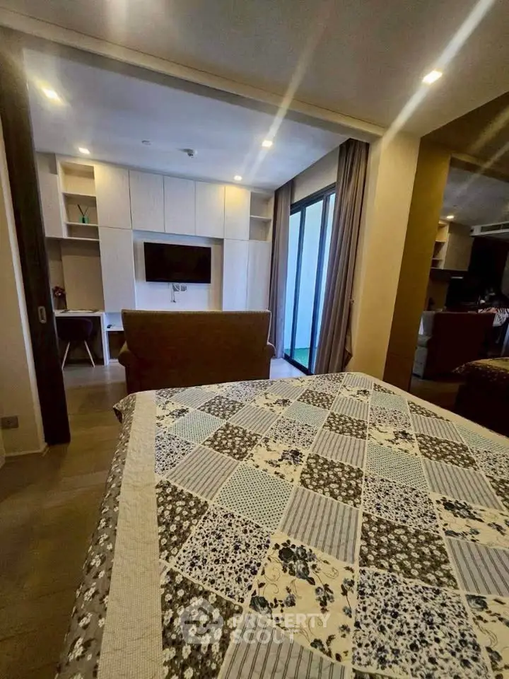 Modern living room with stylish decor and large windows for natural light.