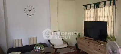Cozy living room with modern decor and large TV setup