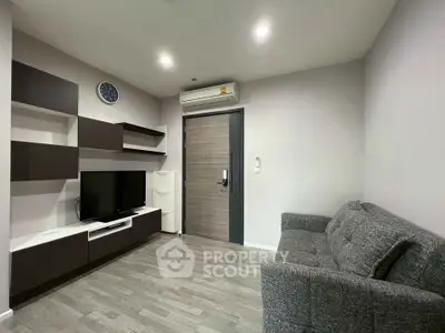 Modern living room with sleek furniture and air conditioning in a stylish apartment.