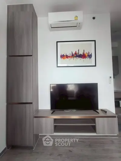 Modern living room with sleek TV stand and air conditioning unit