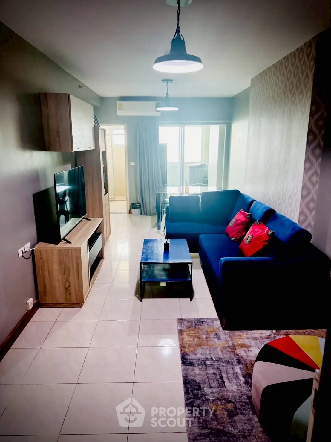 Stylish living room with modern decor and cozy seating in a contemporary apartment.