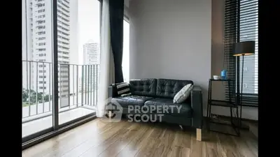 Modern living room with balcony view in high-rise apartment