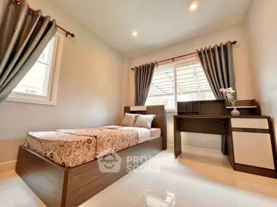 Cozy bedroom with modern furniture and ample natural light