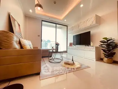 Modern living room with city view, stylish decor, and cozy seating area.