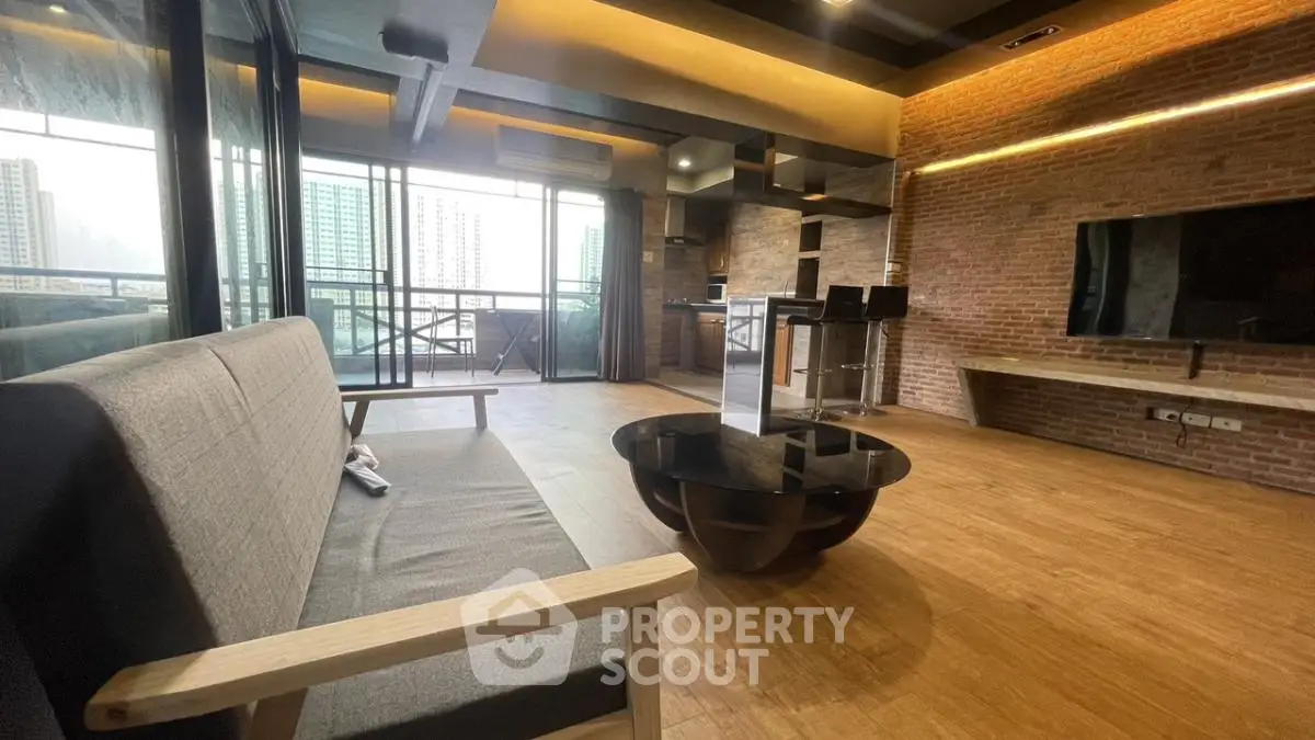 Modern living room with stylish decor and city view balcony