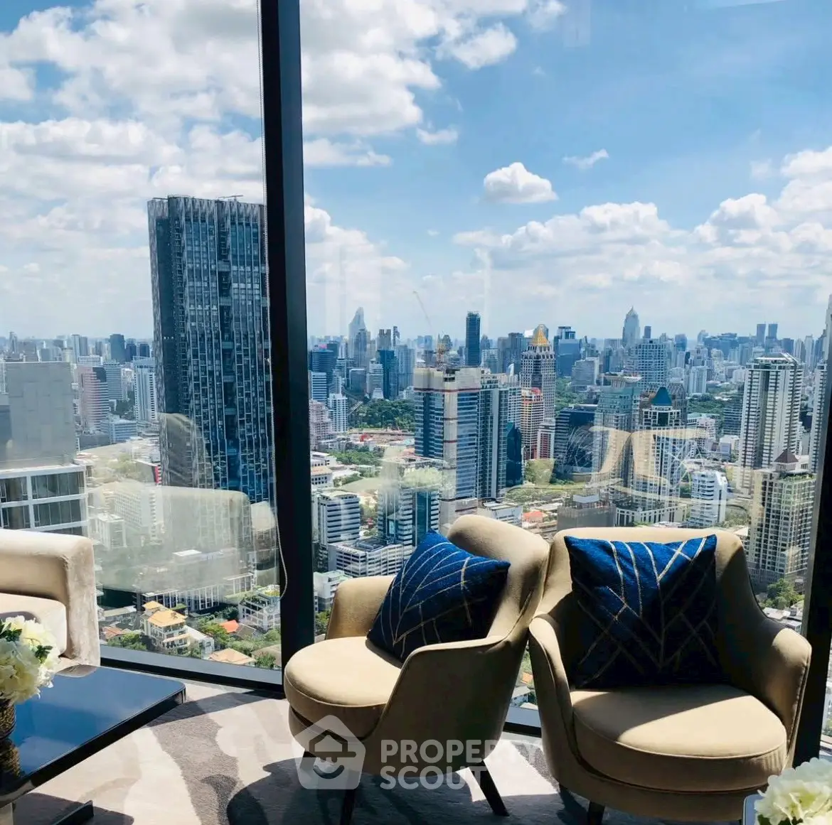 Luxurious high-rise living room with stunning city skyline view