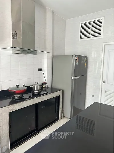 Modern kitchen with sleek appliances and minimalist design