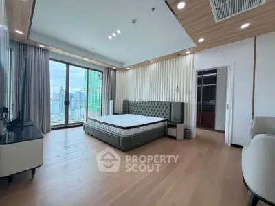 Spacious modern bedroom with city view and elegant decor