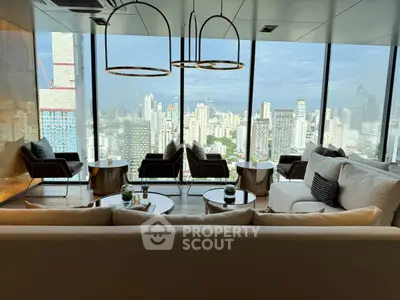 Luxurious high-rise living room with panoramic city skyline views and elegant modern furnishings.
